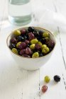 Marinated green and black olives — Stock Photo