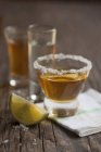 Closeup view of Blanco, Joven and Reposado Tequilla shots with lime wedge — Stock Photo