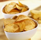 Bowls of cheesy potato chips — Stock Photo