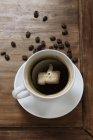 Кава в чашці з подібним символом — стокове фото