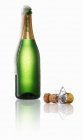 Champagne bubbling out of the bottle — Stock Photo