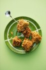Top view of Tortilla nuggets on green plate — Stock Photo