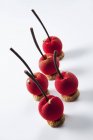 Marzipan cherries with leaf — Stock Photo