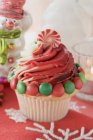 Cupcake decorated with sweets — Stock Photo