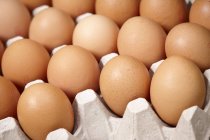 Brown eggs in egg box — Stock Photo