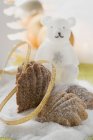 Closeup view of bear paw cookies on sugar with bear-shaped candle — Stock Photo