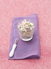 Hering and apple salad with red onions and cream in glass — Stock Photo