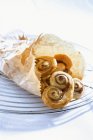 Puff pastries in paper bag — Stock Photo