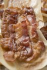 Crispy fried bacon slices — Stock Photo