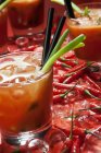 Fresh chili peppers and ice cubes — Stock Photo