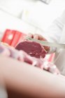 Butcher slicing Lamb — стоковое фото