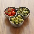 Chillies with giant capers and olives — Stock Photo