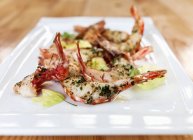 Grilled prawns with herbs — Stock Photo