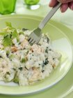 Risotto rice with peas and salmon — Stock Photo