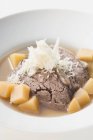 Boiled beef with horseradish in broth — Stock Photo