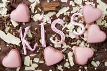 Pink heart shaped chocolates — Stock Photo
