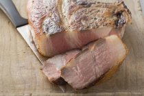 Partly sliced Fried pork chop — Stock Photo