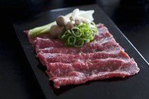 Wagyu beef slices with pak choi — Stock Photo