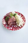 Raw beef with chervil and enoki mushrooms — Stock Photo