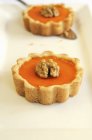 Pumpkin pies with walnuts — Stock Photo