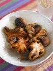 Closeup view of fried octopuses in bowl — Stock Photo