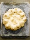 Closeup top view of Pavlova on paper and baking tray — Stock Photo