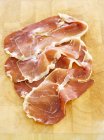 Slices of serrano ham — Stock Photo
