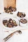 Bowls of fresh morel mushrooms — Stock Photo