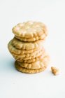 Stack of crackers on white table — Stock Photo
