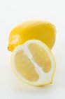 Fresh lemon with half — Stock Photo