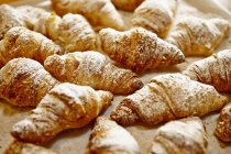 Croissants dusted with icing sugar — Stock Photo