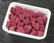 Diced beef in plastic container — Stock Photo