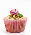 Celebration cupcake decorated with marzipan rose — Stock Photo