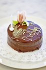 Birthday cake decorated with chocolate glaze — Stock Photo
