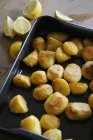 Roasted potatoes on baking tray — Stock Photo