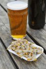 Mussels and glass of beer — Stock Photo