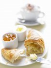 Fresh croissant with butter and jam — Stock Photo