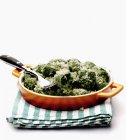 Spinach and cheese in bowl — Stock Photo