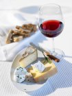 Cheese platter on table outdoors — Stock Photo