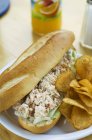 Lobster sandwich with crisps — Stock Photo