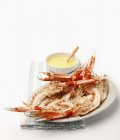 Closeup view of halved scampi with ginger mayonnaise — Stock Photo