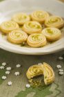 Lemon sables with lime zest on white plate — Stock Photo