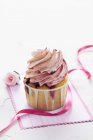 Raspberry yogurt cupcake on post card — Stock Photo