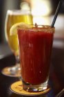 Closeup view of Bloody Mary cocktail and a glass of beer — Stock Photo