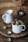 Quail eggs in mug — Stock Photo