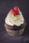 Cupcake with marzipan heart — Stock Photo