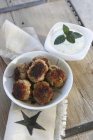Meatballs with mint sauce — Stock Photo