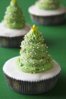 Cupcakes decorated to look like Christmas trees — Stock Photo