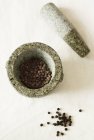 Dried Peppercorns in mortar — Stock Photo