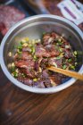 Raw beef in marinade — Stock Photo